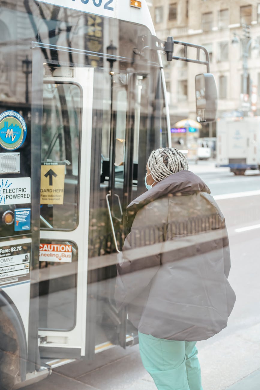 anonymous black doctor against bus in town